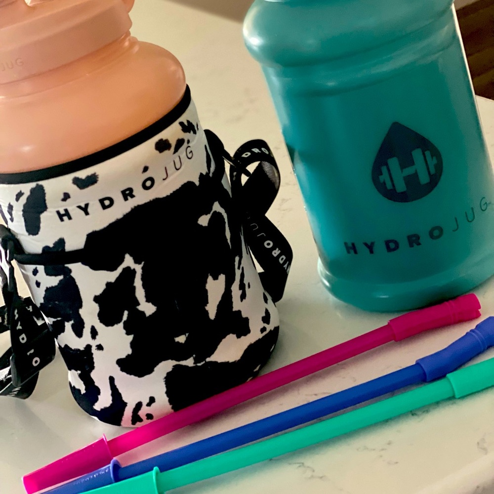 2- Hydrojugs (coral & teal) , 3 straws, 1 cow print sleeve.
